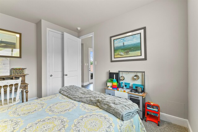 bedroom with a closet and hardwood / wood-style flooring