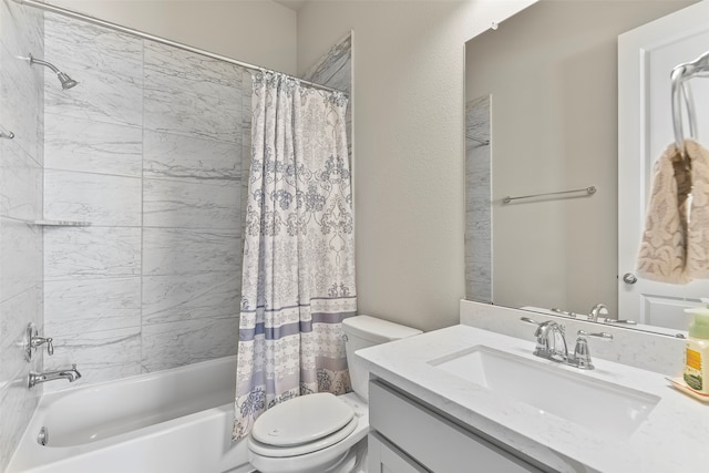 full bathroom with shower / tub combo with curtain, vanity, and toilet