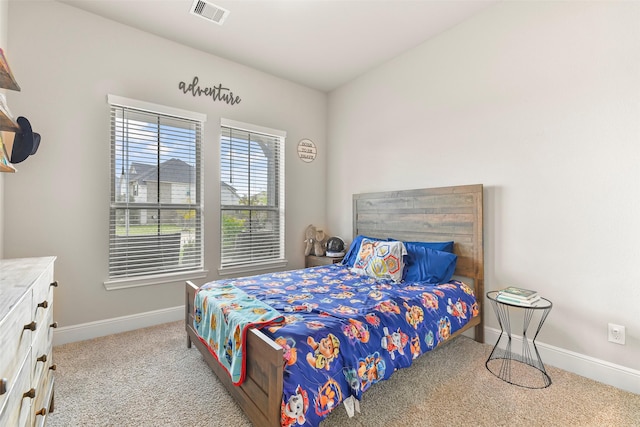 bedroom with light carpet