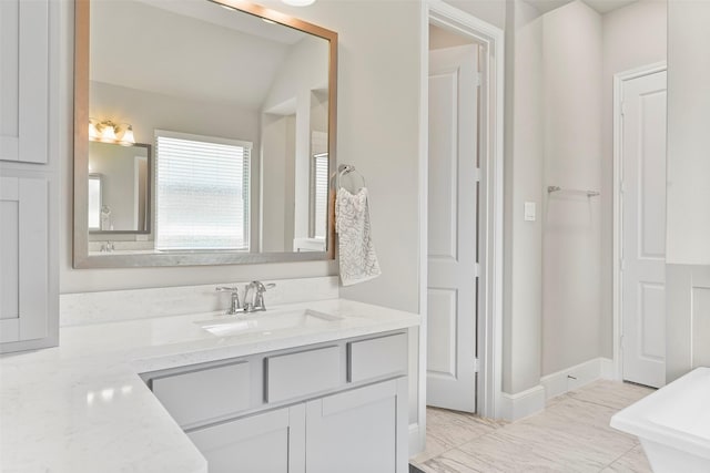 bathroom with tile patterned floors and vanity