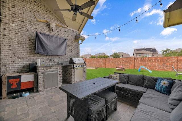 view of patio / terrace with outdoor lounge area, a grill, an outdoor kitchen, and ceiling fan