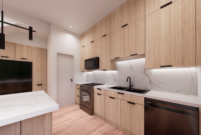 kitchen with light brown cabinets, sink, light hardwood / wood-style flooring, and black appliances