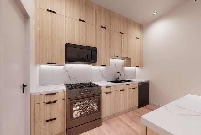 kitchen featuring black appliances, sink, light hardwood / wood-style flooring, light brown cabinetry, and tasteful backsplash