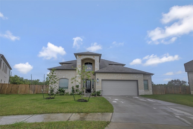 view of front facade with a garage and a front yard