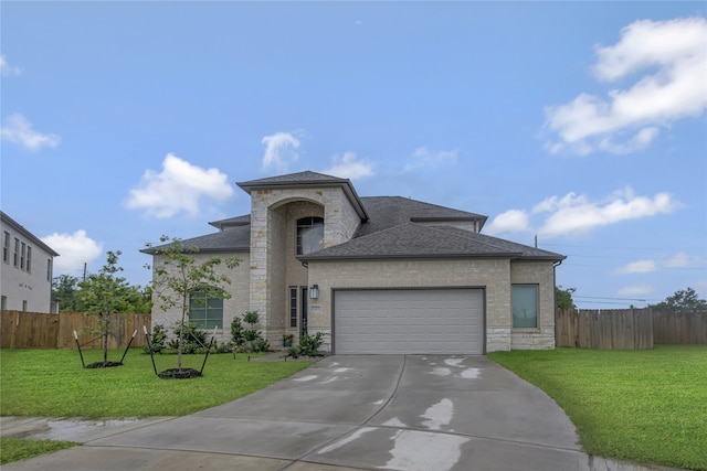 view of front of home featuring a garage and a front yard