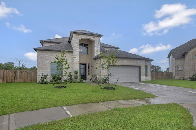 view of front of home featuring a garage and a front lawn