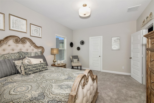 bedroom with light colored carpet