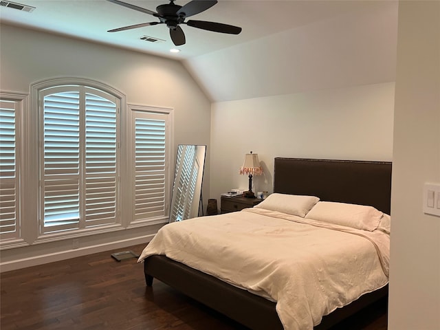 bedroom with ceiling fan, dark hardwood / wood-style floors, and vaulted ceiling