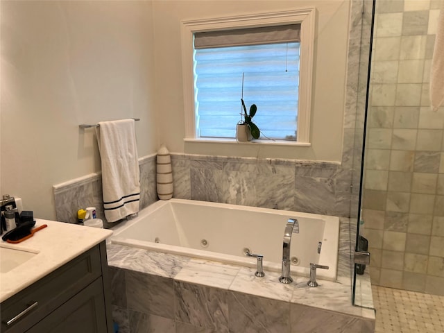 bathroom with separate shower and tub and vanity