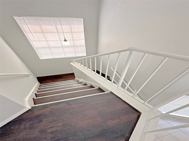 stairway featuring hardwood / wood-style flooring