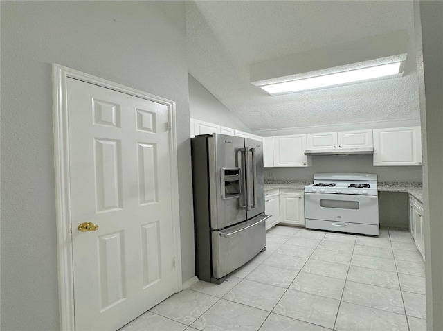 kitchen featuring white cabinetry, vaulted ceiling, a textured ceiling, white gas stove, and stainless steel fridge with ice dispenser