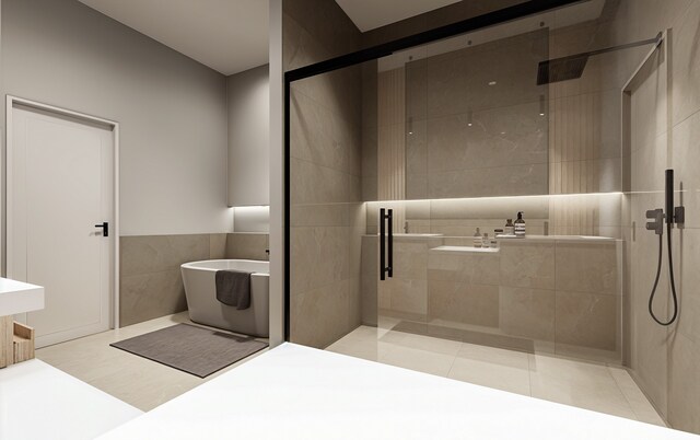 bathroom featuring tile patterned flooring, independent shower and bath, and tile walls