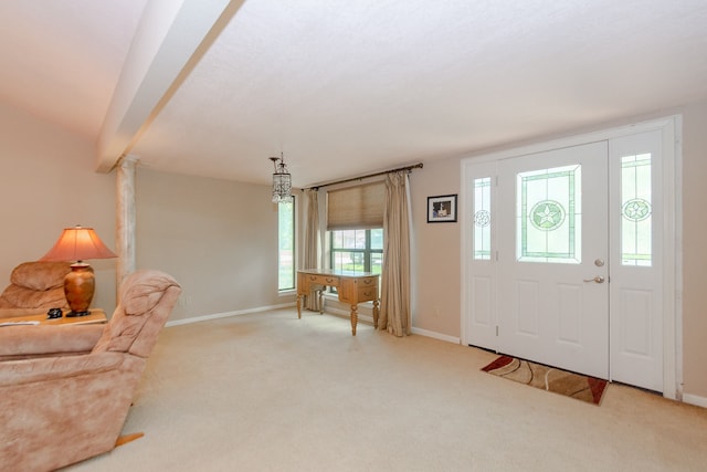 entrance foyer with light carpet