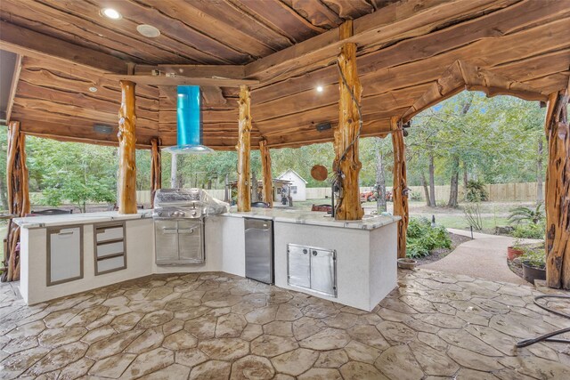 view of patio / terrace featuring area for grilling and a grill