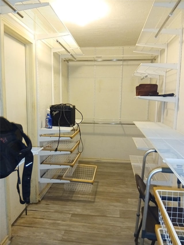 spacious closet featuring hardwood / wood-style floors