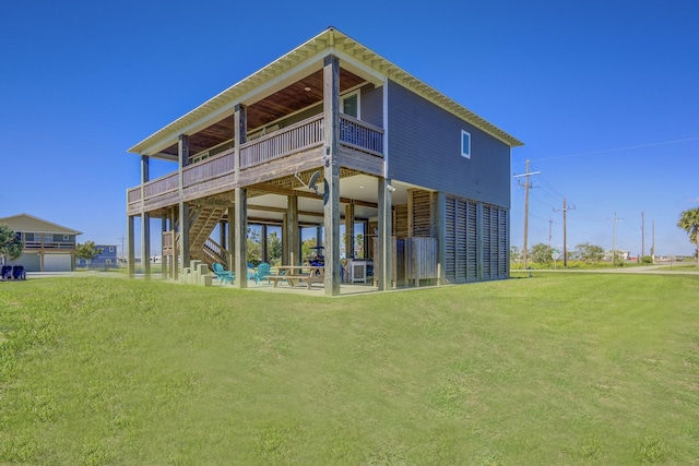 back of house with a lawn