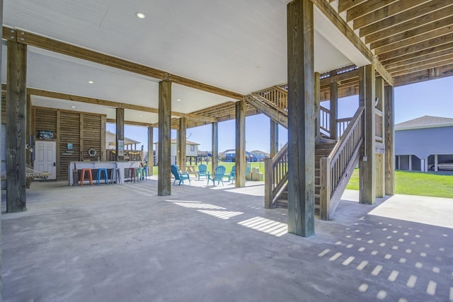 view of patio with stairway and outdoor dry bar