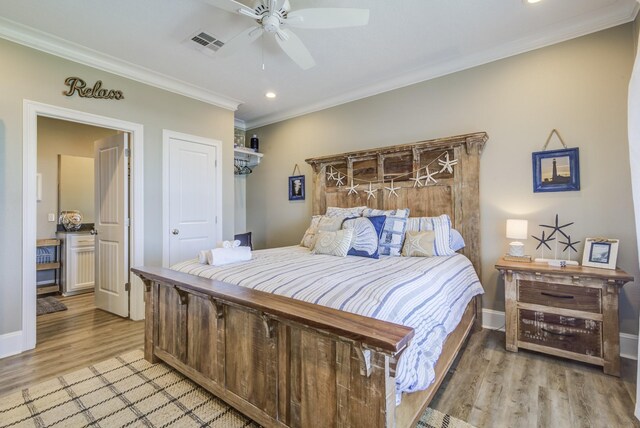 bedroom with light hardwood / wood-style flooring, crown molding, and ceiling fan