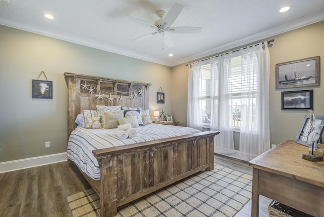 bedroom featuring baseboards, ornamental molding, and wood finished floors