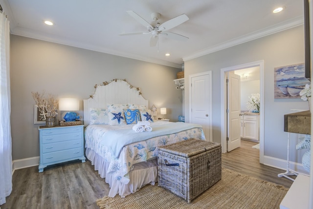 bedroom featuring crown molding, hardwood / wood-style flooring, ensuite bath, and ceiling fan