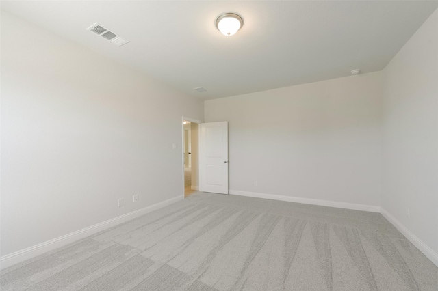 spare room with light colored carpet