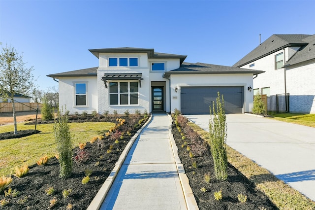 9931 Hunters Run Dr, Missouri City, TX 77459 - prairie-style home featuring a garage and a front yard