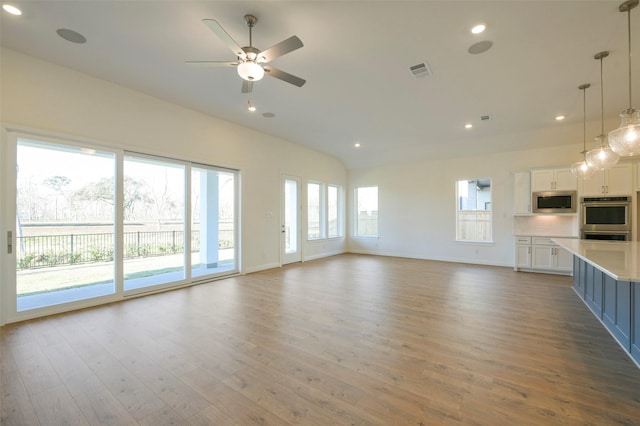 9931 Hunters Run Dr, Missouri City, TX 77459 - unfurnished living room with wood-type flooring and ceiling fan