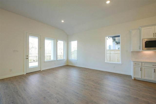 9931 Hunters Run Dr, Missouri City, TX 77459 - interior space featuring lofted ceiling and light wood-type flooring