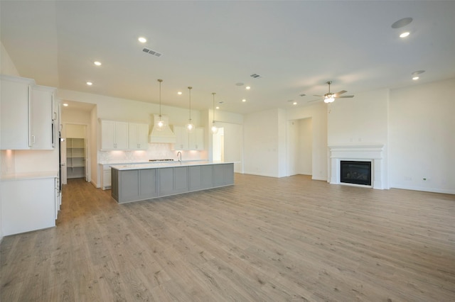 9931 Hunters Run Dr, Missouri City, TX 77459 - unfurnished living room with ceiling fan and light hardwood / wood-style flooring