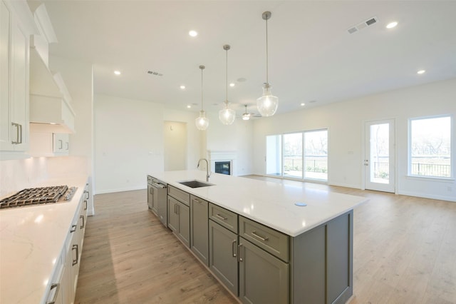 9931 Hunters Run Dr, Missouri City, TX 77459 - kitchen featuring stainless steel appliances, gray cabinets, sink, and white cabinets