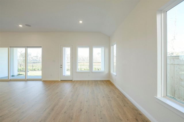 9931 Hunters Run Dr, Missouri City, TX 77459 - spare room featuring vaulted ceiling and light hardwood / wood-style flooring