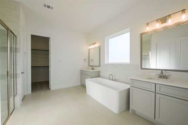 9931 Hunters Run Dr, Missouri City, TX 77459 - bathroom featuring vanity, tile patterned floors, and shower with separate bathtub