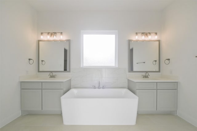 9931 Hunters Run Dr, Missouri City, TX 77459 - bathroom featuring a tub to relax in, tile patterned floors, and vanity