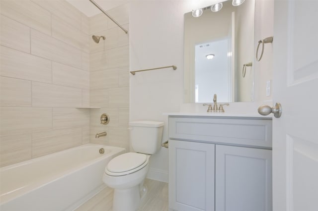 9931 Hunters Run Dr, Missouri City, TX 77459 - full bathroom with tiled shower / bath, vanity, and toilet