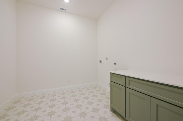 9931 Hunters Run Dr, Missouri City, TX 77459 - laundry area featuring cabinets and electric dryer hookup