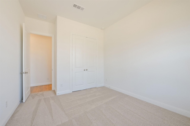 9931 Hunters Run Dr, Missouri City, TX 77459 - unfurnished bedroom with light colored carpet and a closet