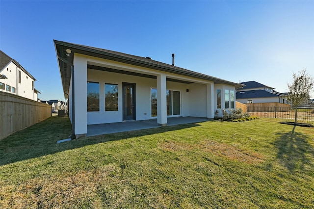 9931 Hunters Run Dr, Missouri City, TX 77459 - back of house with a patio and a yard