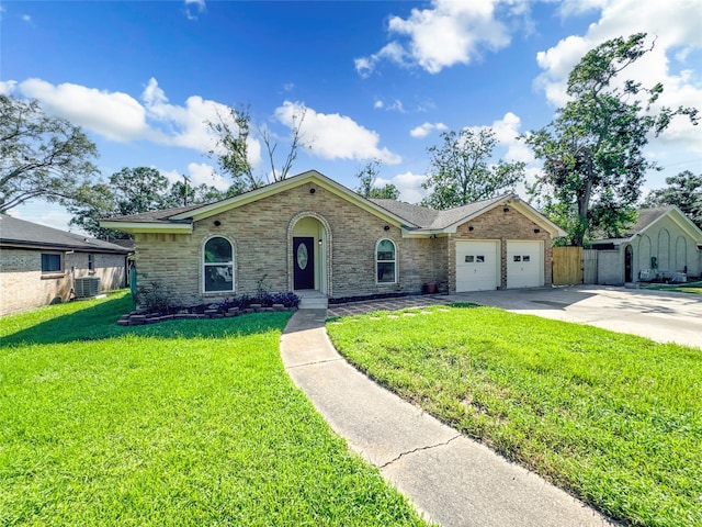 ranch-style home featuring a garage, a front lawn, and central AC