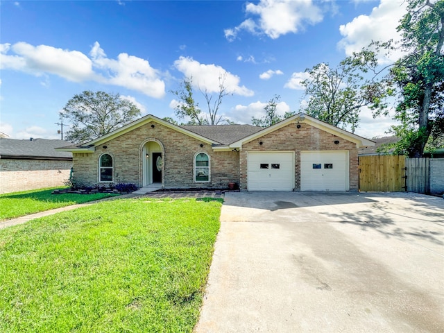 ranch-style house with a garage and a front lawn