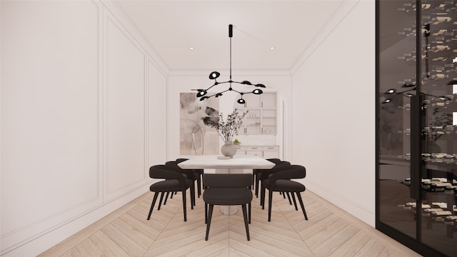 dining room featuring light parquet floors and crown molding