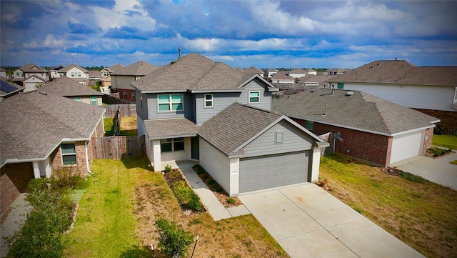 view of front of house with a garage and a front lawn