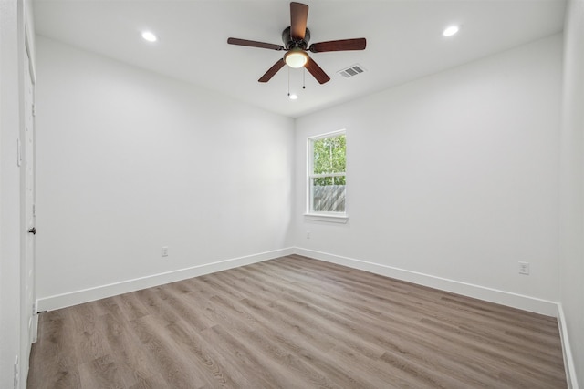 unfurnished room featuring light hardwood / wood-style floors and ceiling fan