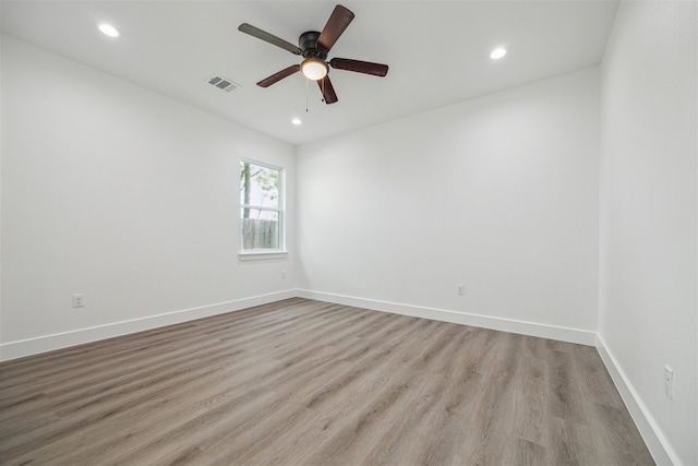 unfurnished room featuring light wood-type flooring and ceiling fan