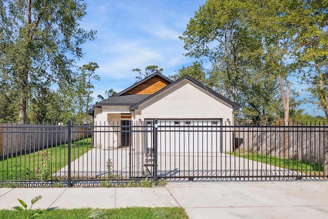 view of front of house with a garage and a front yard