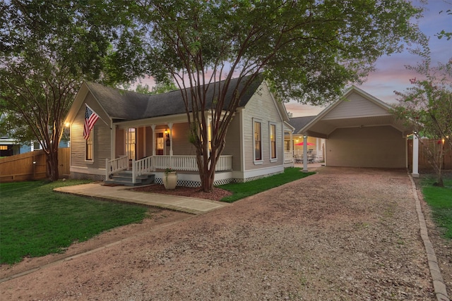 view of front of house featuring a porch and a carport