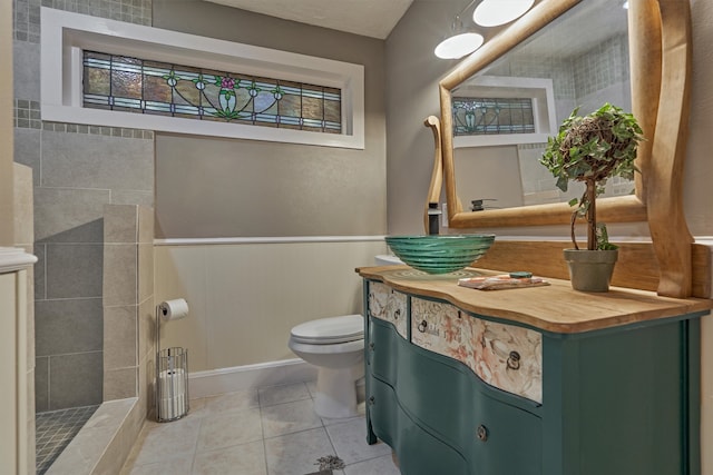 bathroom featuring tile patterned floors, toilet, and vanity