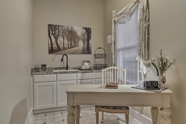 office area featuring sink and light tile patterned floors