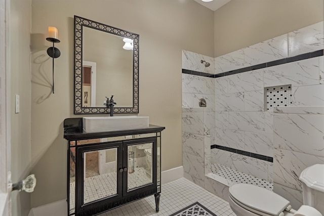 bathroom with tile patterned flooring, toilet, sink, and a tile shower