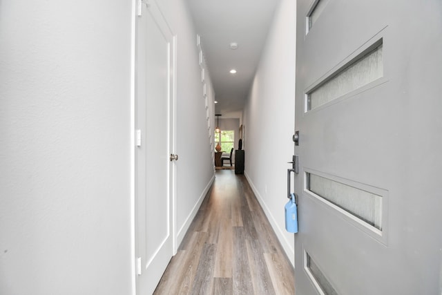 corridor with wood-type flooring