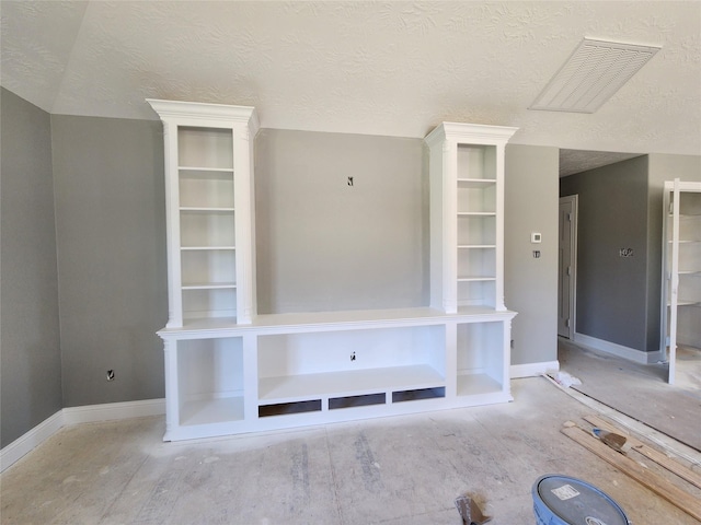 unfurnished living room featuring a textured ceiling